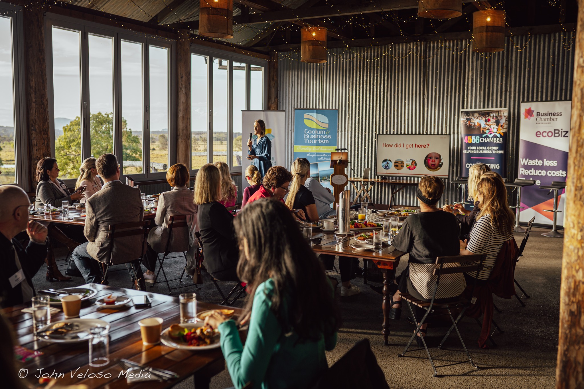 A conference set up in the barn with presentation boards and seated delegates