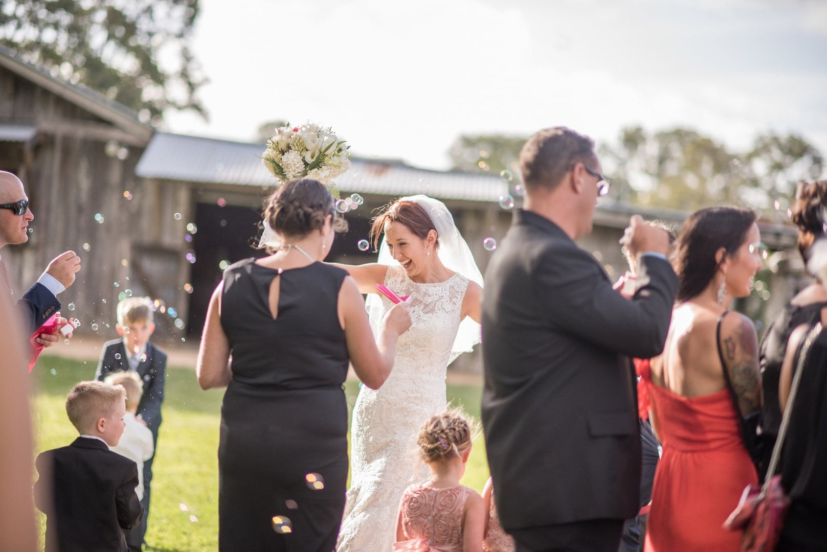 Guests gathered outside a cottage on the lawn